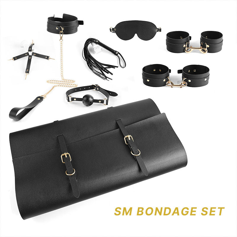 Wondebliss 7-piece bondage kit full set in black, including collar, cuffs, eye mask, mouth gag, whip and storage bag