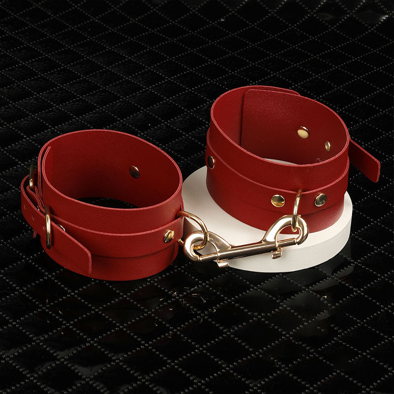Wondebliss faux leather ankle cuffs with metal hardware from 7-piece bondage restraint kit