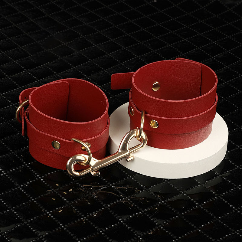 Wondebliss faux leather handcuffs with sturdy metal hardware from bondage kit