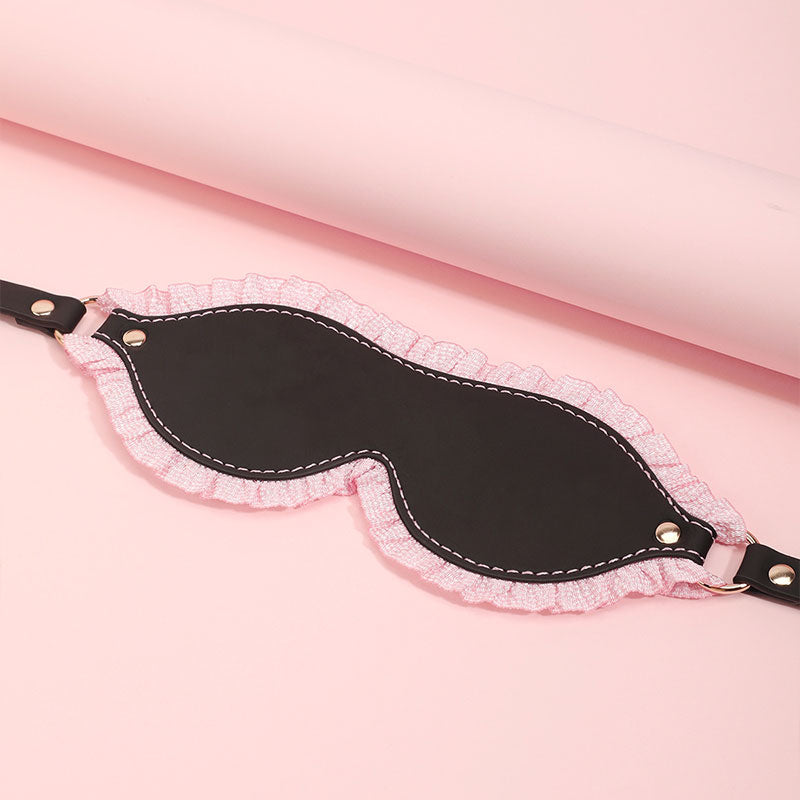 Wondebliss soft black eye mask with pink lace detail from bondage restraint kit