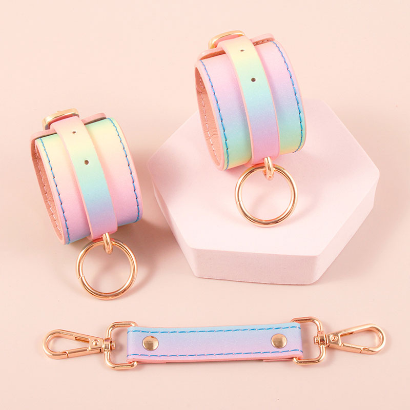 Wondebliss rainbow faux leather handcuffs with metal hardware from 8-piece bondage kit