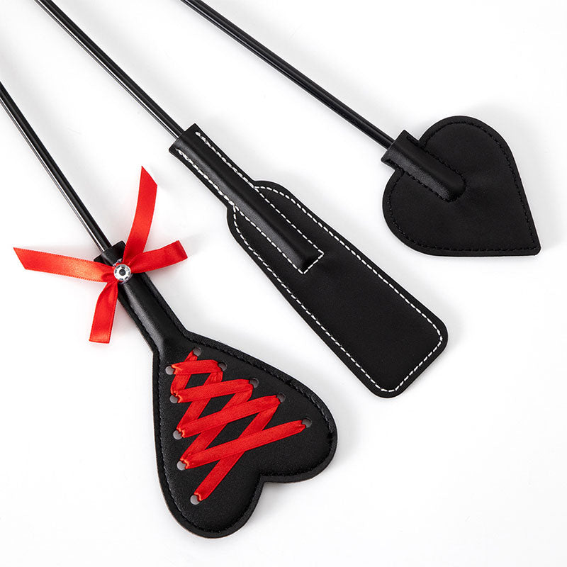 Wondebliss spanking paddle collection partial view showing multiple styles