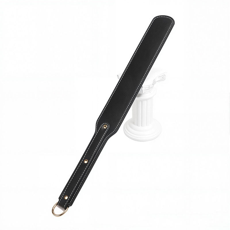 Wondebliss black faux leather spanking paddle with fine stitching detail

