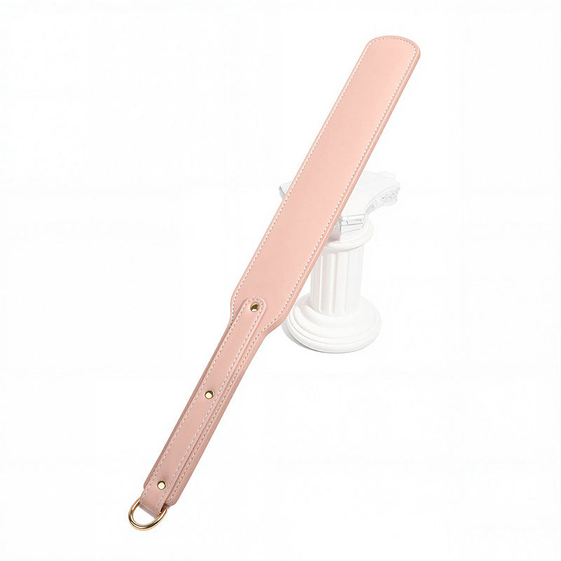 Wondebliss pink faux leather spanking paddle with fine stitching detail