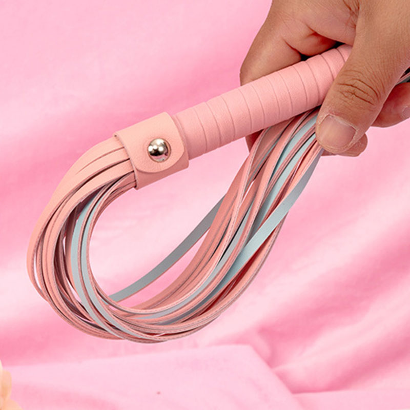 Wondebliss faux leather tassel whip hand-held detail showing comfortable grip and tassel length