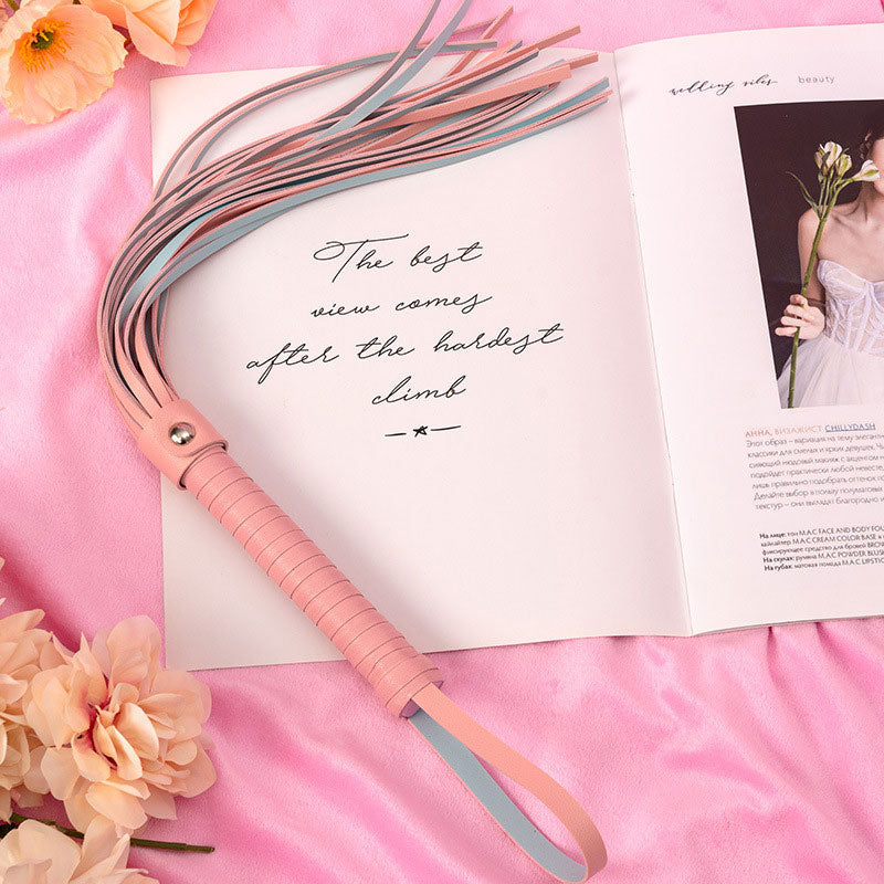 Wondebliss pink faux leather tassel whip with metal hardware detail