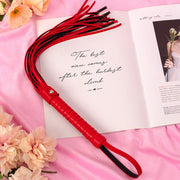 Wondebliss red faux leather tassel whip with metal hardware detail
