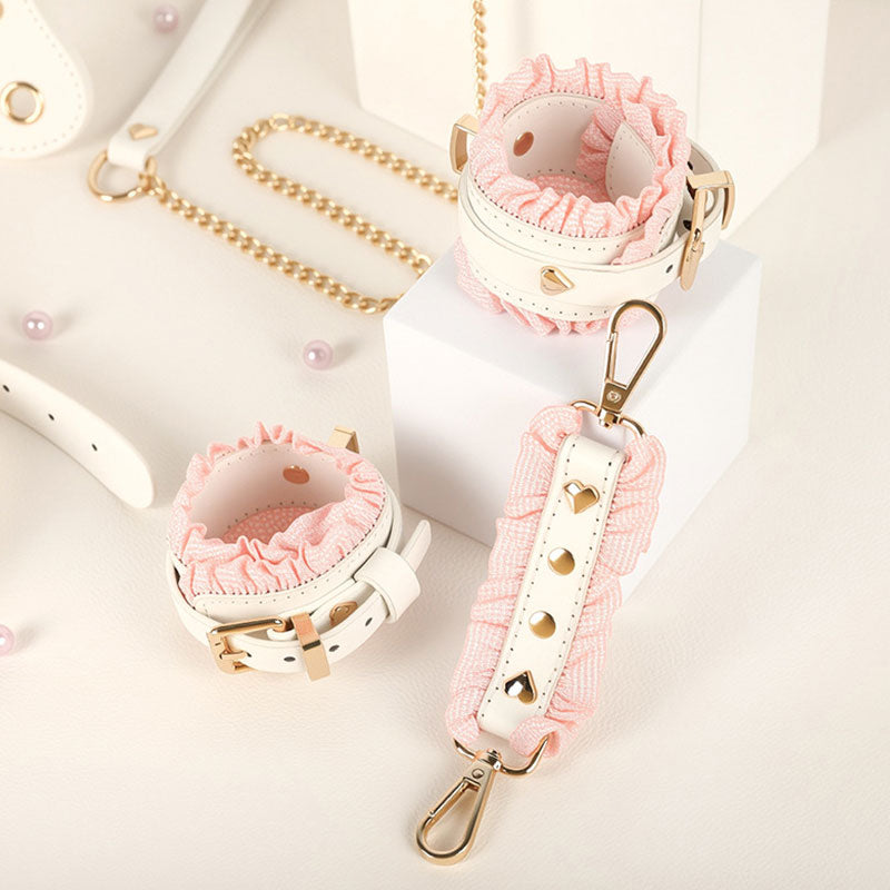 Wondebliss white and pink faux leather ankle cuffs from 6-piece bondage set