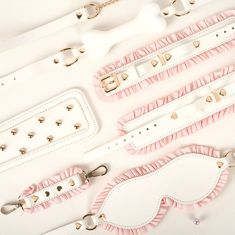 Wondebliss white and pink 6-piece bondage set flat lay detail, all pieces displayed