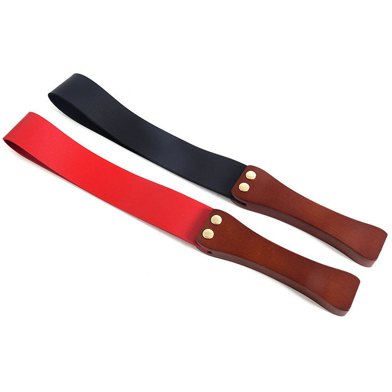 Wondebliss wooden handle spanking paddle in black and red flat lay display